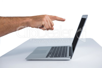 Male executive pointing at laptop