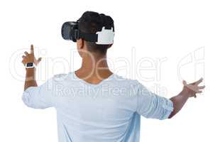 Rear view of man using virtual reality headset