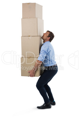 Male executive carrying stack of cardboard boxes