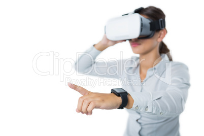 Female executive using virtual reality headset