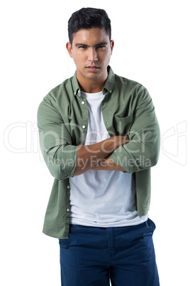 Confident man standing with arms crossed on white background