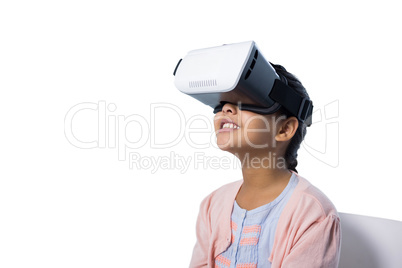 Cute girl using virtual reality glasses