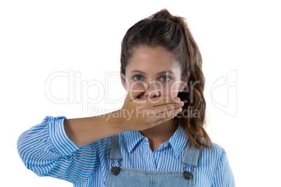 Teenage girl standing against white background