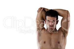 Portrait of determind shirtless sports player stretching hands