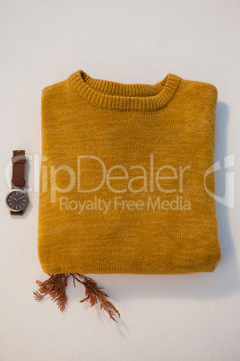 Warm clothing with watch on white background