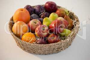 Close-up of various fruits in wicker basket