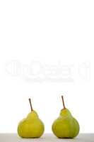 Close-up of two pears on table