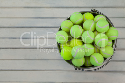 Overhead view of tennis balls in metallic bucket
