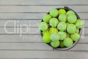 Overhead view of tennis balls in metallic bucket