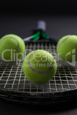 Close up of balls on tennis racket