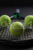 Close up of balls on tennis racket