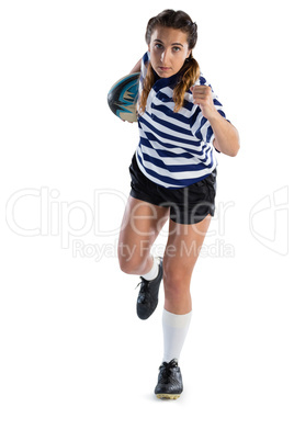 Full length of female athlete with rugby ball running