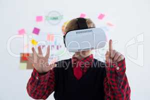 Boy as business executive using virtual reality headset