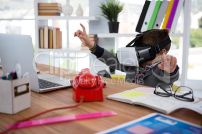 Boy as business executive using virtual reality headset