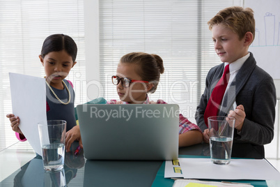 Kids as business executives interacting while meeting