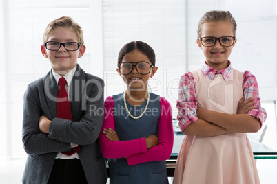 Kids as business executive smiling while standing in the office