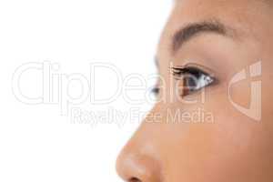 Womans eye and nose against white background