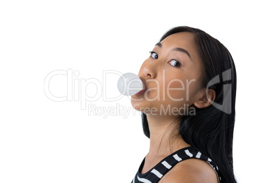 Woman blowing bubble gum