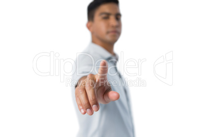Man pretending to touch an invisible screen against white background