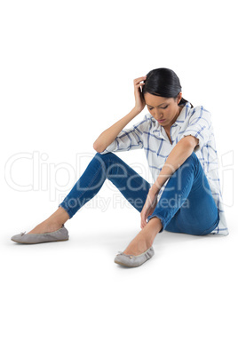 Woman relaxing against white background