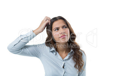 Female executive standing against white background