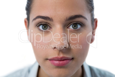 Surprised female executive standing against white background