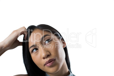 Woman standing against white background