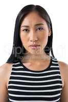 Depressed woman standing against white background