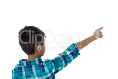 Boy pointing finger against white background