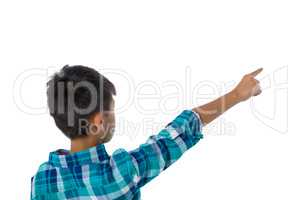 Boy pointing finger against white background