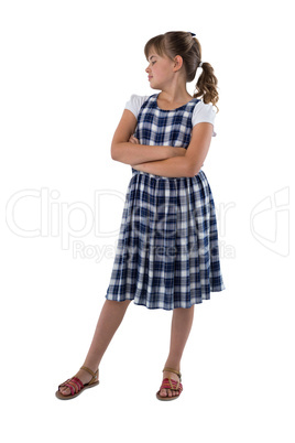 Girl standing with arms crossed on white background