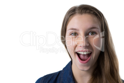 Excited teenage girl standing against white background