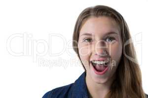 Excited teenage girl standing against white background