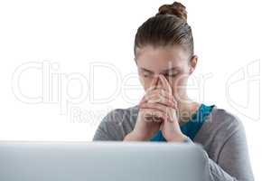 Teenage girl sitting against white background