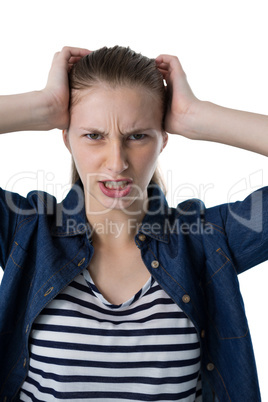 Frustrated teenage girl scratching her head