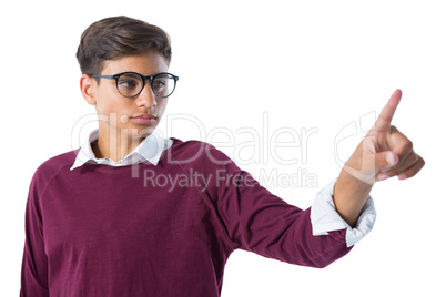 Teenage boy touching an invisible screen