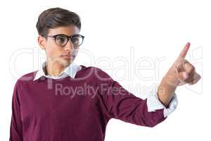 Teenage boy touching an invisible screen