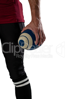 Cropped image of sports player holding ball