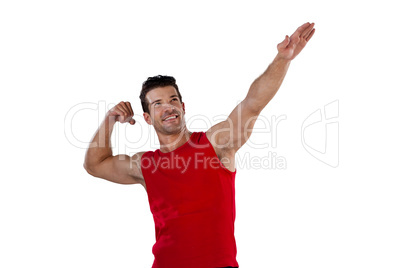 Confident smiling sports player stretching arms
