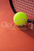 Close up of ball against tennis racket