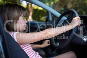 Teenage girl driving a car