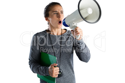 Female rugby coach announcing on megaphone