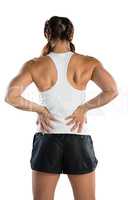 Rear view of sportswoman suffering from back pain