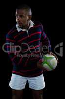 Male athlete holding rugby ball
