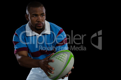 Male athlete looking away while playing rugby