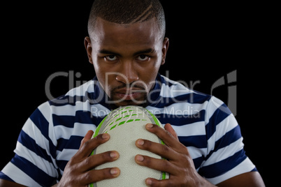 Close up portrait of serious male rugby player