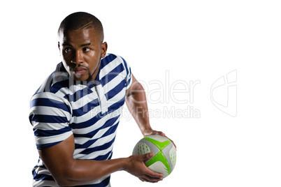 Sportsman looking away while playing rugby