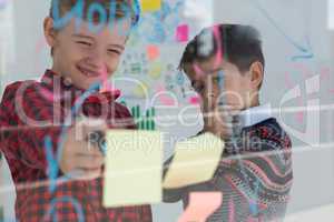 Kids as business executives discussing over whiteboard