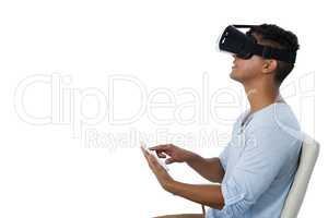 Man using virtual reality headset and digital tablet