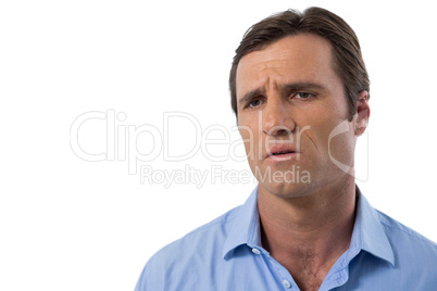 Confused man against white background